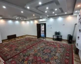 اتاق پذیرایی و بخاری و تلوزیون قدیمی آپارتمان در لاهیجان 568486